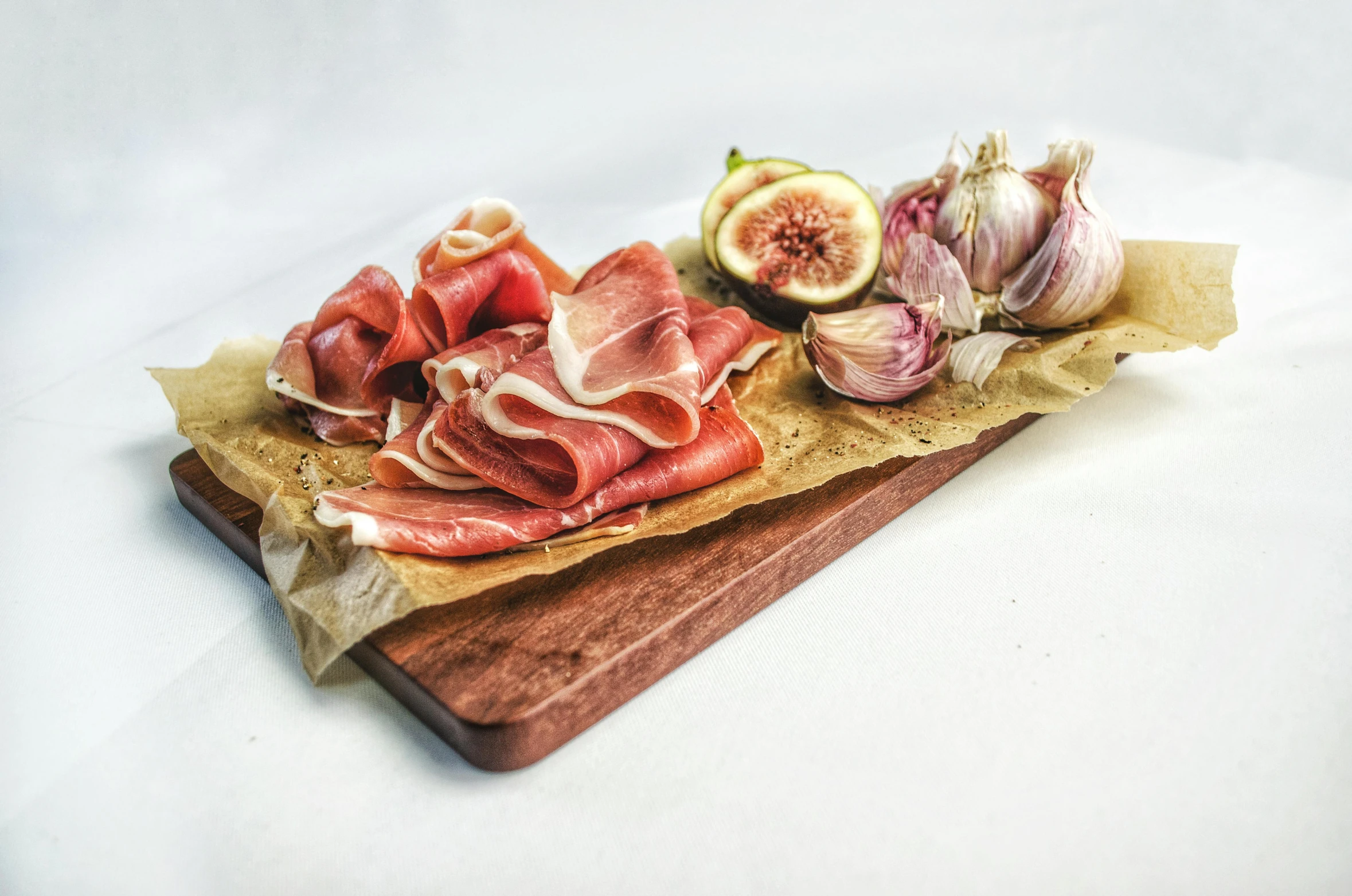 a close up of a cutting board with food on it, posing for camera, product view, pointè pose, organic flesh