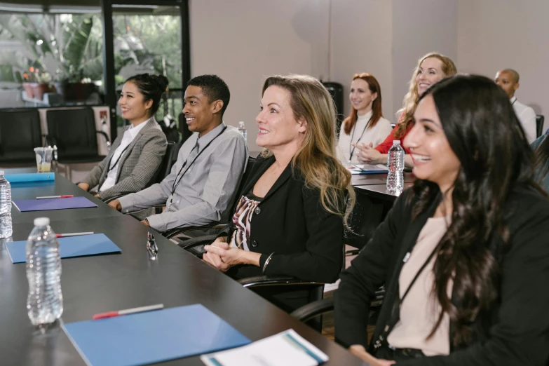 a group of people sitting around a conference table, profile image, uhq, guide, commercial