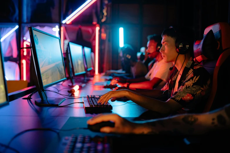 a group of people playing a video game, pexels, computer art, blue and red lights, brass equipment and computers, avatar image, contain