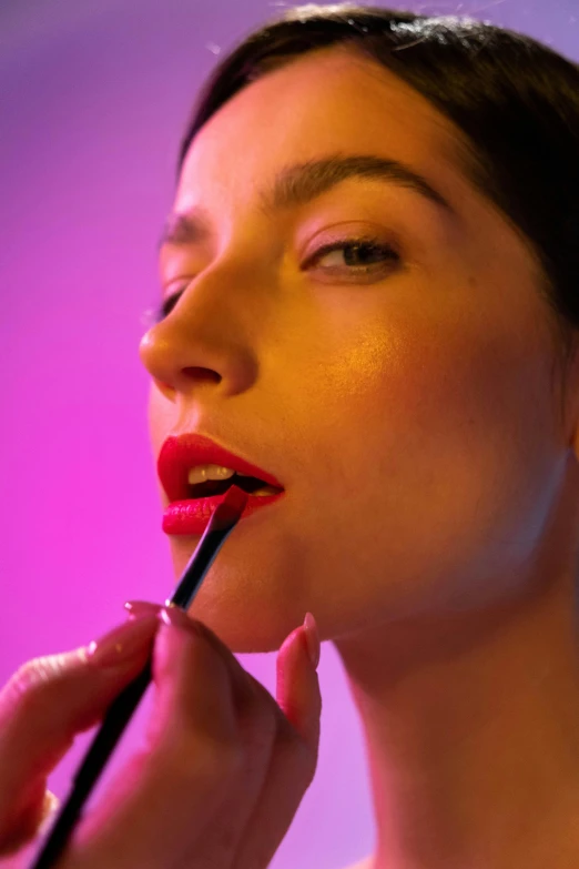 a woman is putting lipstick on her lips, by Julia Pishtar, photorealism, bright vivid lighting, sephora, lorde, promo image