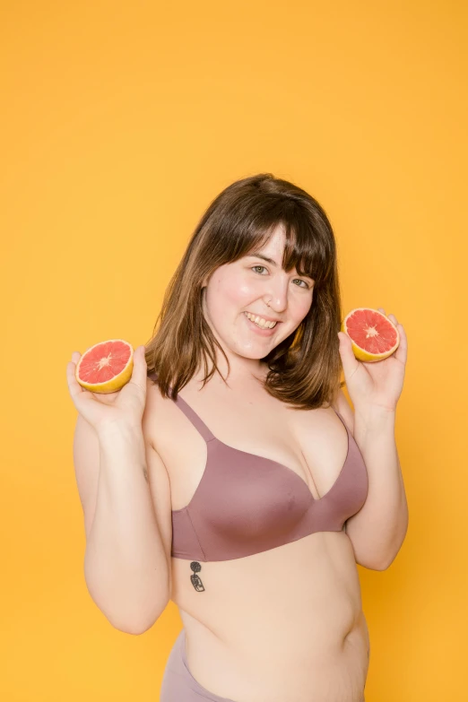 a woman in a bikini holding two grapefruits, an album cover, shutterstock contest winner, andy milonakis, h3h3, low quality photo, headshot profile picture