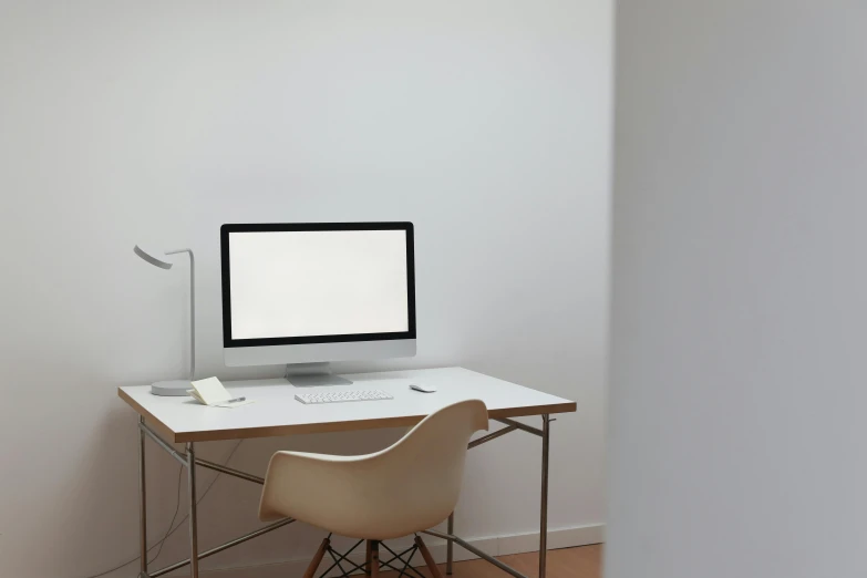 a computer sitting on top of a white desk, pexels, ignant, empty white room, evenly lit, furnished room