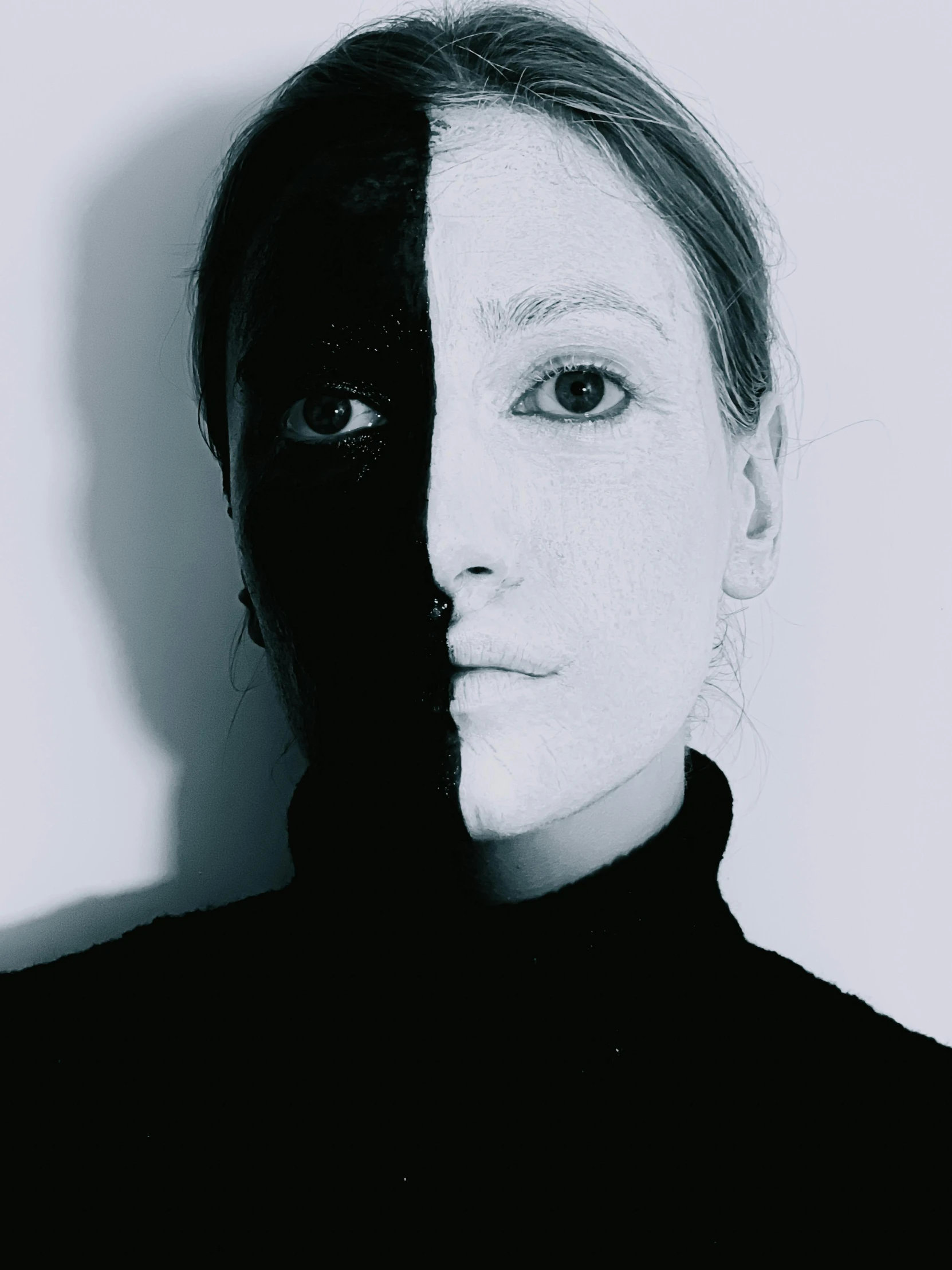 a woman with her face painted black and white, inspired by Anna Füssli, split in half, half tone, with black, with black eyes