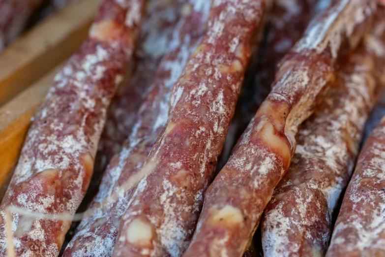 a close up of a bunch of sausage sticks, a portrait, by Julian Hatton, pexels, renaissance, meat and lichens, made of glazed, sicilian, red meat shreds