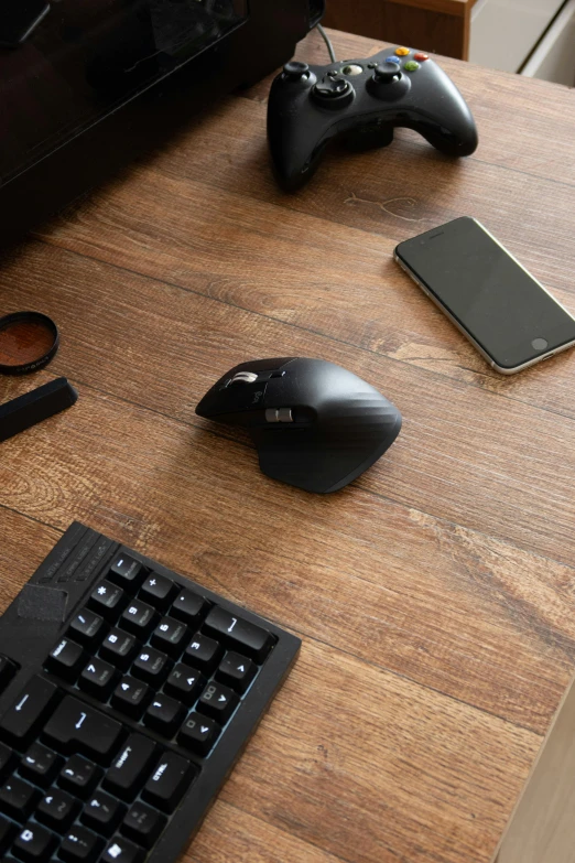 a computer keyboard sitting on top of a wooden desk, product image, cyborg mouse, curving black, thumbnail