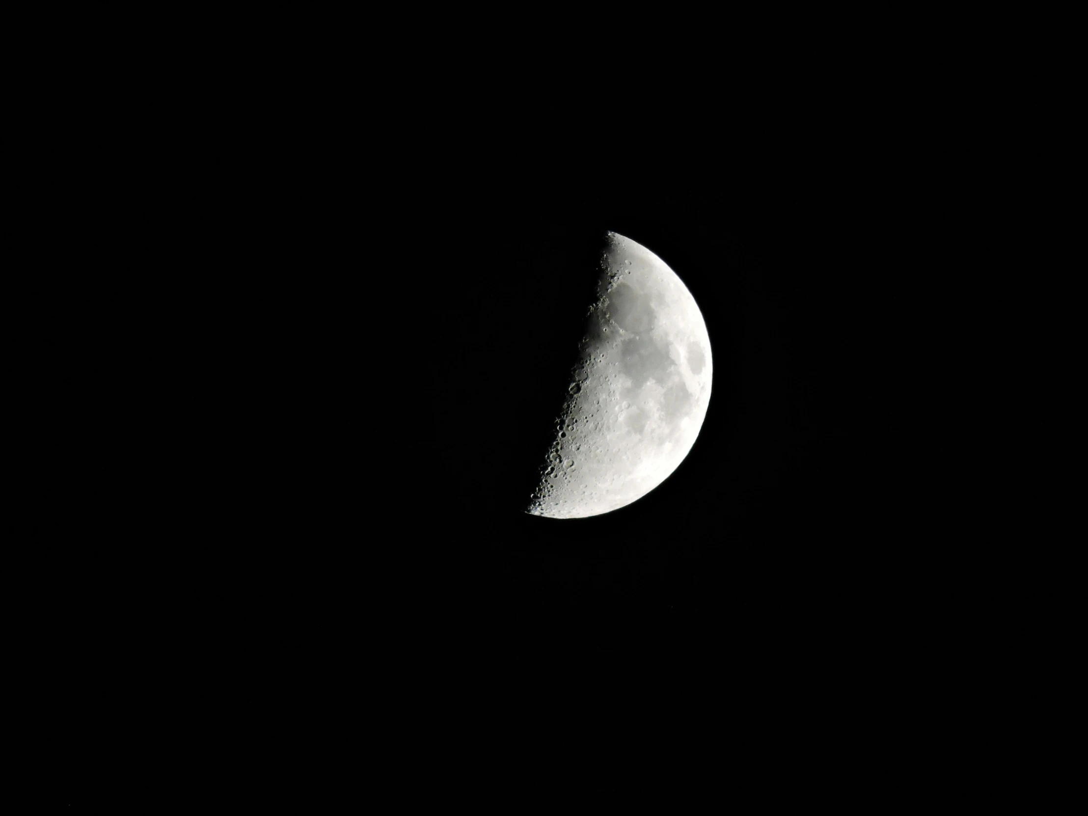 the moon is lit up in the dark sky, pexels, minimalism, night time footage, monochrome:-2, half and half, ☁🌪🌙👩🏾