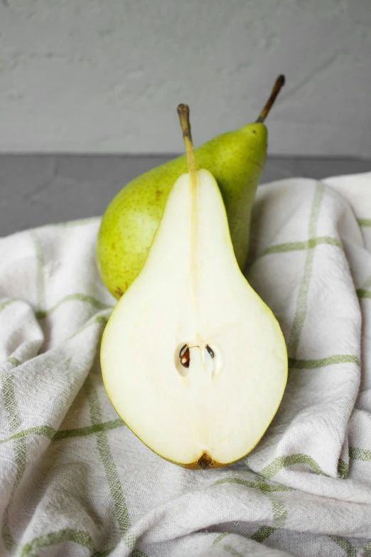 a couple of pears sitting on top of a towel, award - winning crisp details, fan favorite, organics, full face