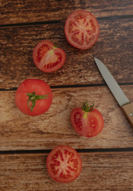 tomatoes and a knife on a wooden table, pexels contest winner, slightly smirking, no - text no - logo, petite, on clear background