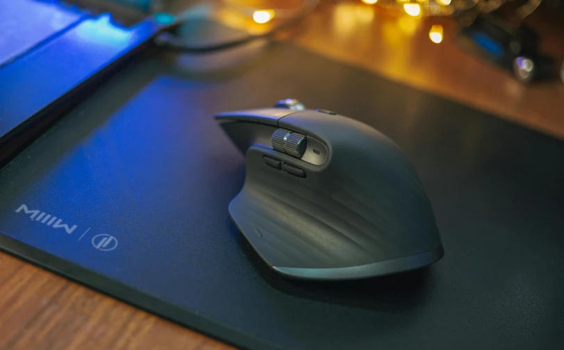 a computer mouse sitting on top of a mouse pad, pexels contest winner, chiron, nighttime!, mmo, candid shot