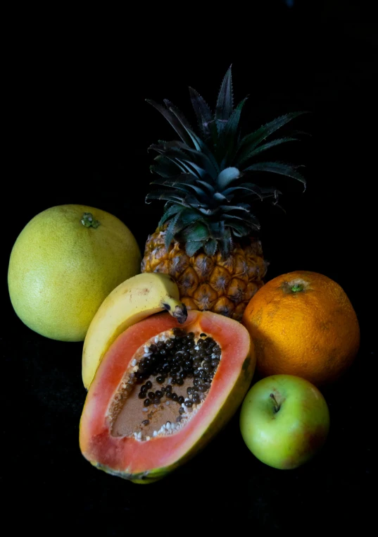 a bunch of fruit sitting on top of a table, with a black background, slide show, tropical mood, full product shot