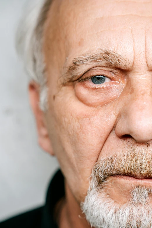 a close up of a man with a beard, a character portrait, inspired by Lajos Vajda, unsplash, photorealism, the look of an elderly person, large eyes with visible pupils, portrait of hide the pain harold, woman's face looking off camera