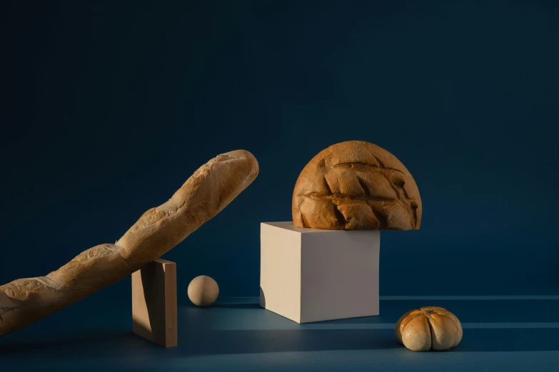 a loaf of bread sitting on top of a white box, a still life, inspired by Gillis Rombouts, trending on polycount, brancusi, wooden art toys on base, various angles, alessio albi