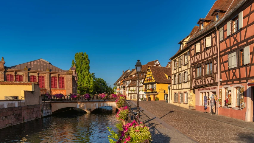 a street lined with buildings next to a river, a photo, renaissance, french village exterior, at golden hour, slide show, lpoty