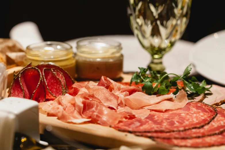 a close up of a plate of food on a table, cheese and salami on the table, 🦩🪐🐞👩🏻🦳, bogna gawrońska, daily specials