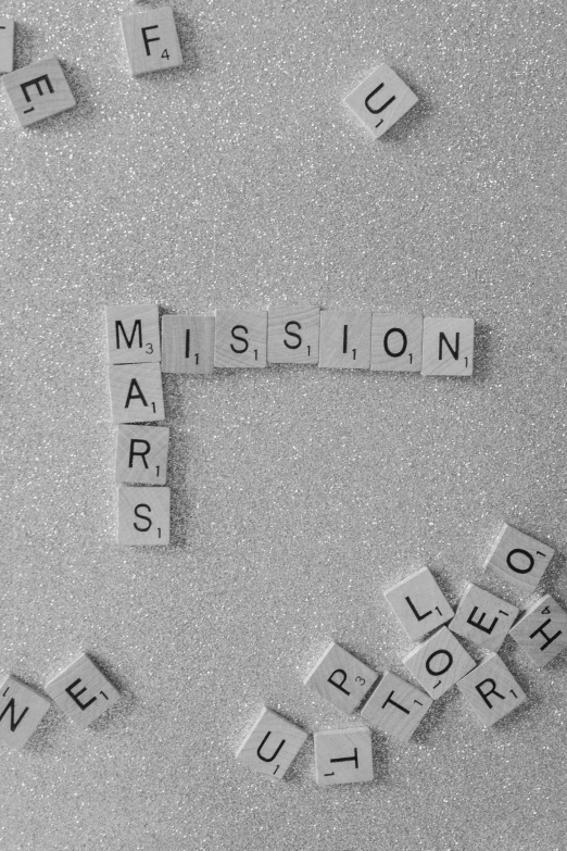 a black and white photo of scrabbles on a refrigerator, an album cover, unsplash, massurrealism, mars mission, 2 5 6 x 2 5 6 pixels, letters, space station planet afar