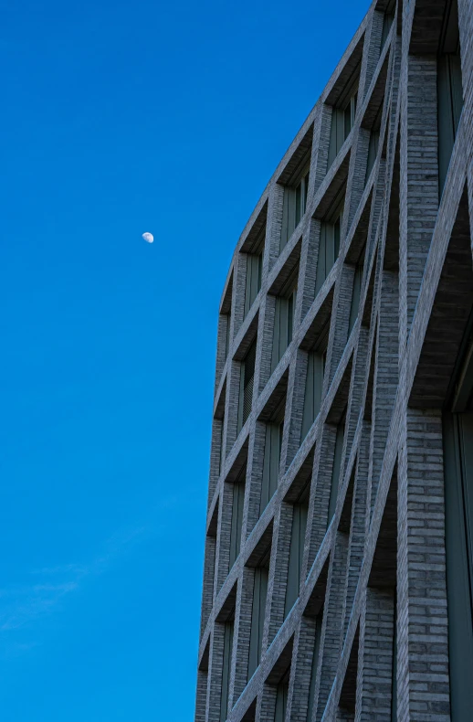 a very tall building with a moon in the sky, inspired by Tadao Ando, unsplash, brutalism, hoog detail, f / 1. 9 6. 8 1 mm iso 4 0, crescent moon, full daylight