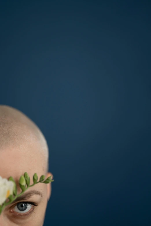 a man with a flower crown on his head, an album cover, by Maciej Kuciara, trending on unsplash, postminimalism, shaved bald head, wedding, detail shot, blue head