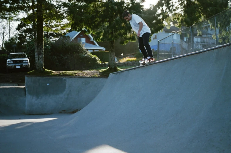 a man riding a skateboard up the side of a ramp, a picture, charli bowater, in the park, ash thorp khyzyl saleem, smooth contours