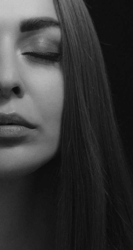 a black and white photo of a woman with her eyes closed, a black and white photo, pexels, photorealism, lips, close up character, young woman with long dark hair, portrait shot 8 k