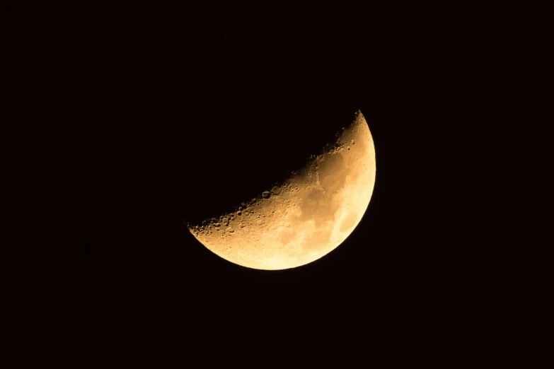 the moon is lit up in the dark sky, an album cover, by Peter Churcher, pixabay, hurufiyya, sickle, 2 0 0 mm telephoto, gold, low iso