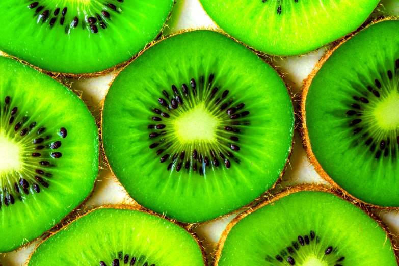 a group of kiwi slices sitting on top of each other, a digital rendering, pexels, vibrant green, 🦩🪐🐞👩🏻🦳, close up food photography, kaleidoscopic