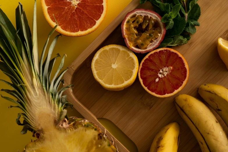 a pineapple, oranges, bananas, and other fruits on a cutting board, inspired by Évariste Vital Luminais, trending on pexels, background image, opening shot, aesthetic shot, full product shot
