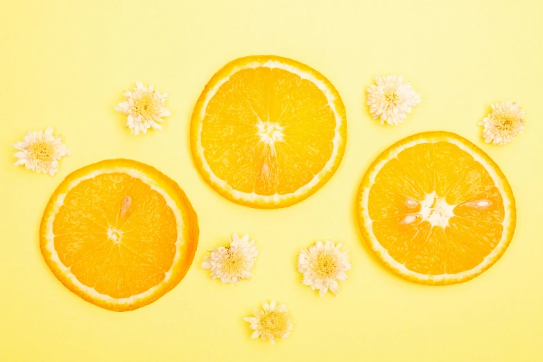 orange slices and flowers on a yellow background, trending on pexels, background image, the three suns, full body image, skincare