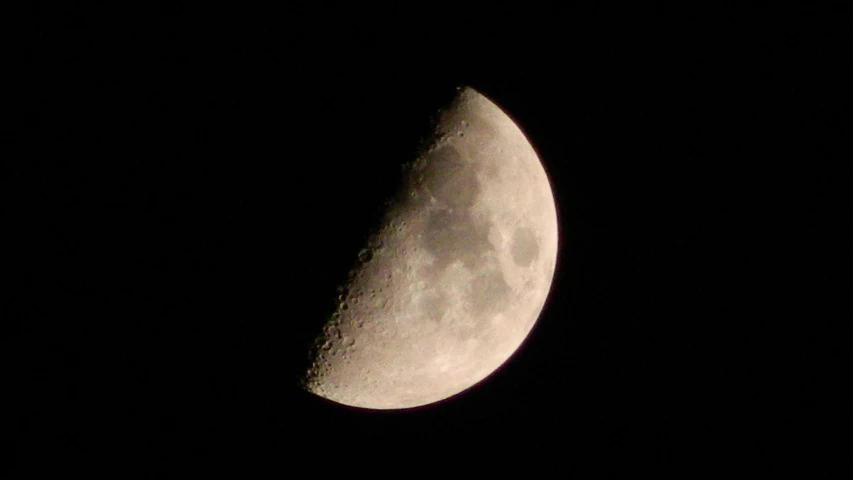 a half moon is seen in the dark sky, a photo, flickr, shot on a 2 0 0 3 camera, night time footage, various posed, noon