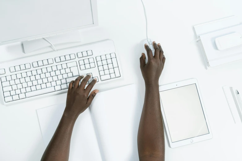 a person is typing on a computer keyboard, trending on unsplash, white background : 3, laying down with wrists together, afro tech, ignant