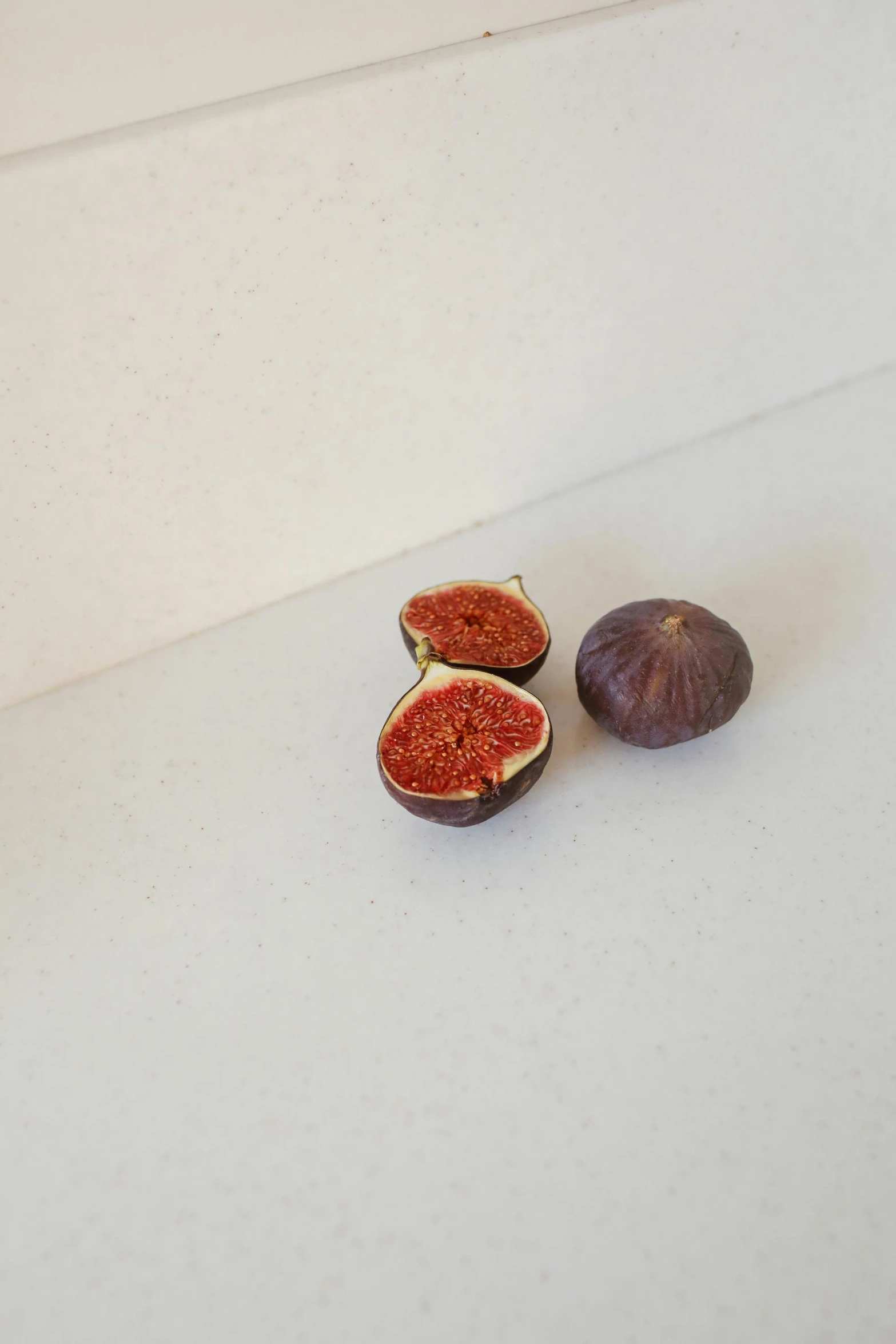 a couple of figurines sitting on top of a counter, a picture, by Jens Søndergaard, reddit, figuration libre, passion fruits, highly detailed product photo, reddish, abundant fruition seeds