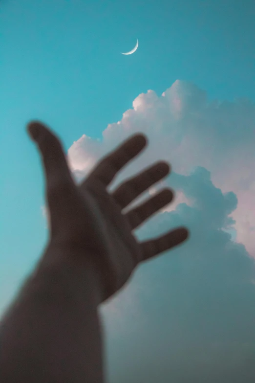 a hand reaching up to the sky with a crescent in the background, unsplash, volumetric clouds, portrait photo, 2 0 5 6, medium - shot