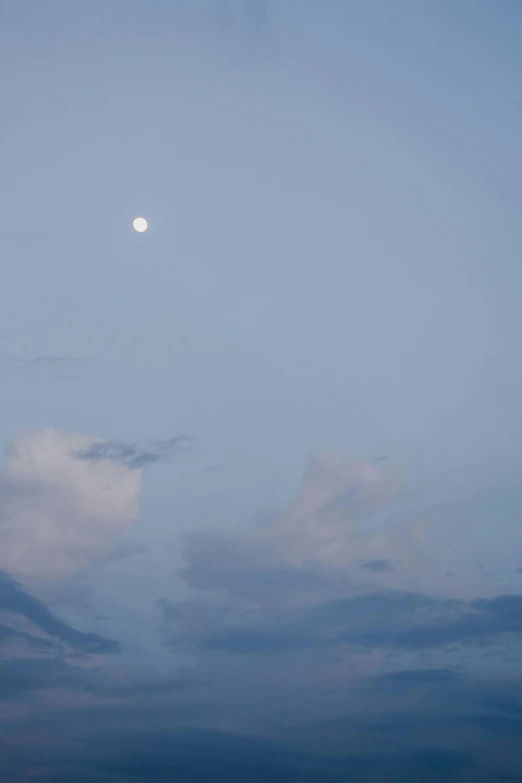 a plane flying in the sky with a full moon in the background, a picture, by Peter Churcher, minimalism, soft lilac skies, color photograph, cloud, 4 0 9 6