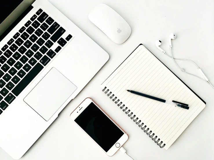 an open laptop computer sitting on top of a white desk, trending on pexels, taken on an iphone, knolling, 9 9 designs, white and black