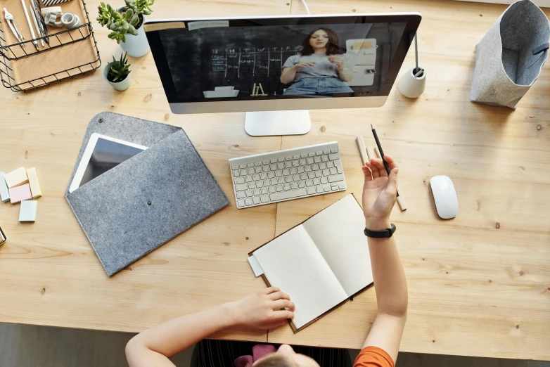 a person sitting at a desk in front of a computer, trending on pexels, educational supplies, high angle shot, avatar image, whiteboards