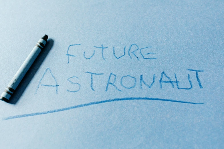 a piece of paper with the words future astronaut written on it, trending on tumblr, futurism, star charts, blue ballpoint pen, astral ethereal, strong artificial intelligence