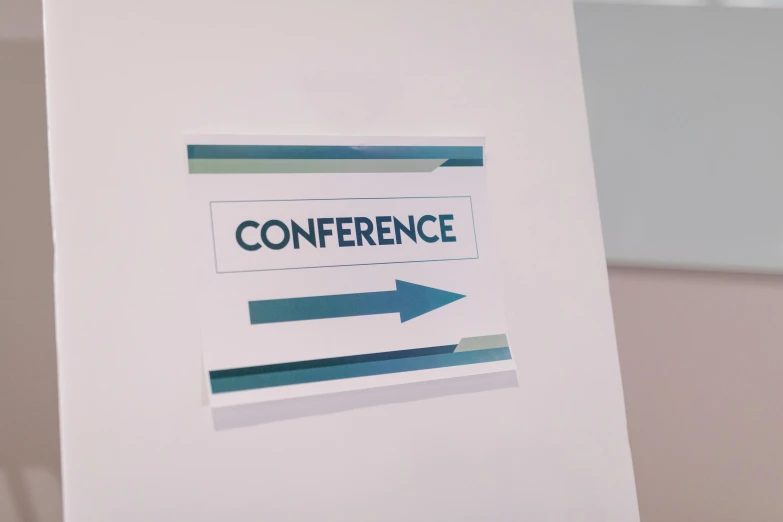 a conference sign sitting on top of a table, wall art, digital image, middle close up, thumbnail