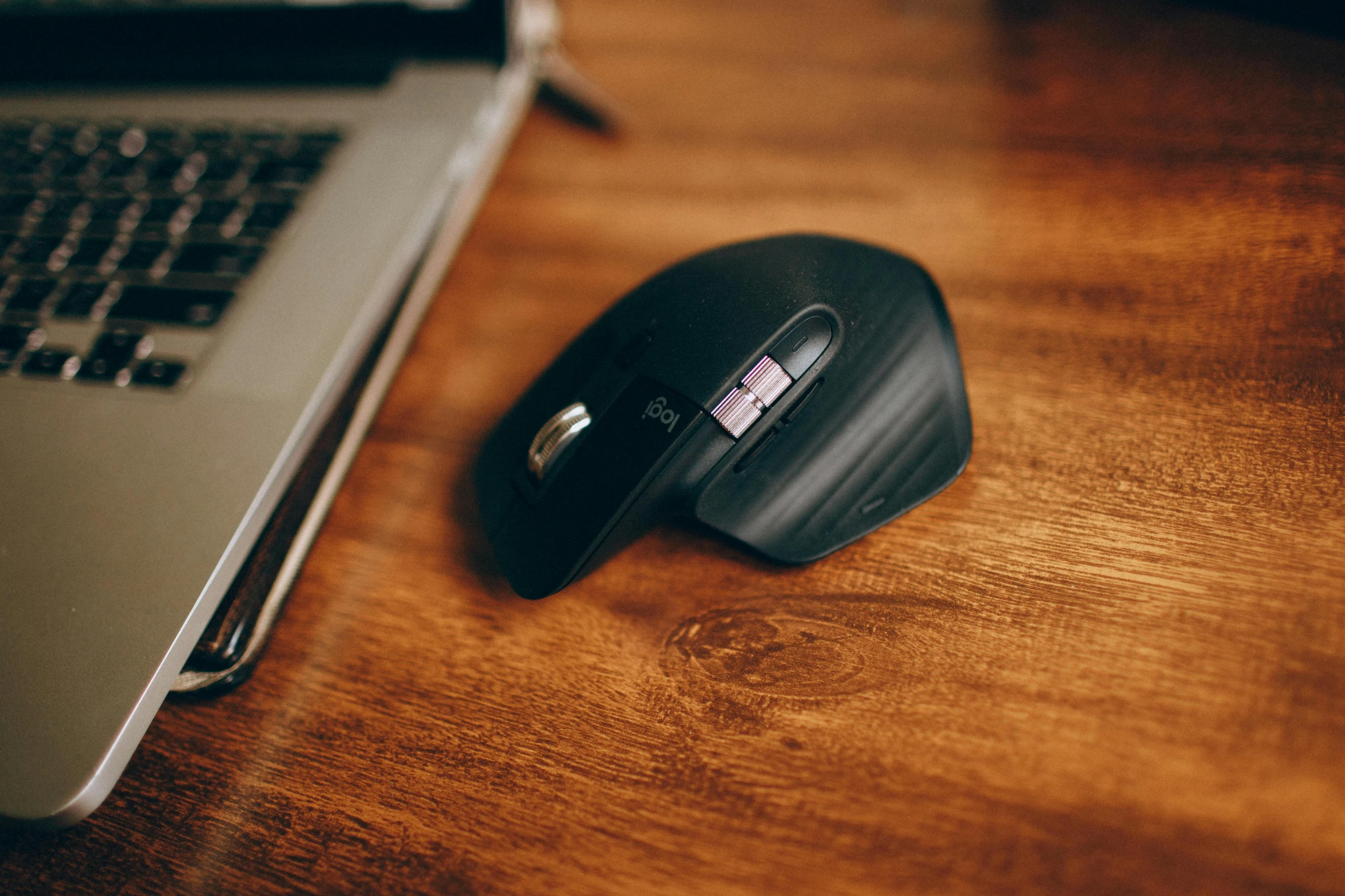 a computer mouse sitting on top of a wooden desk, by Adam Marczyński, pexels contest winner, avatar image, angle view, carbon, “the ultimate gigachad