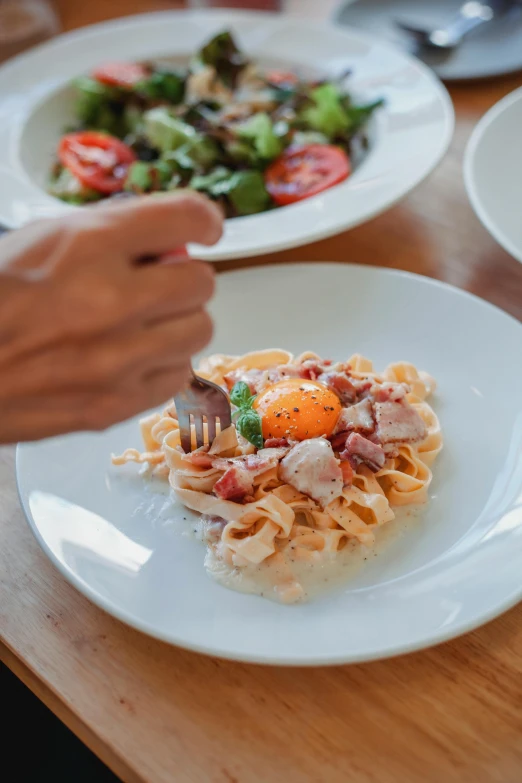 a close up of a plate of food on a table, by Carlo Martini, eating noodles, square, medium, seasonal