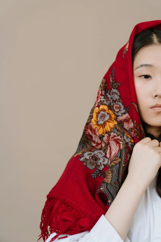 a woman in a white shirt and a red scarf, inspired by Jin Nong, trending on unsplash, cloisonnism, wearing a red hoodie, frown fashion model, russian academic, a young asian woman