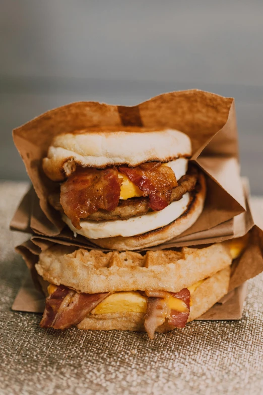 a couple of sandwiches stacked on top of each other, a portrait, trending on pexels, deconstructed waffle, bao pnan, bacon, 6 : 3 0 am