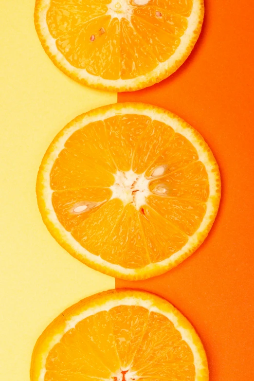 three slices of orange sitting on top of each other, by Carey Morris, trending on pexels, colors: yellow, laura watson, half moon, 🐿🍸🍋