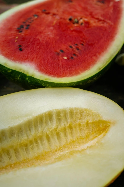 a close up of a sliced watermelon on a table, renaissance, slide show, f/3.5, abundant fruition seeds, jen yoon
