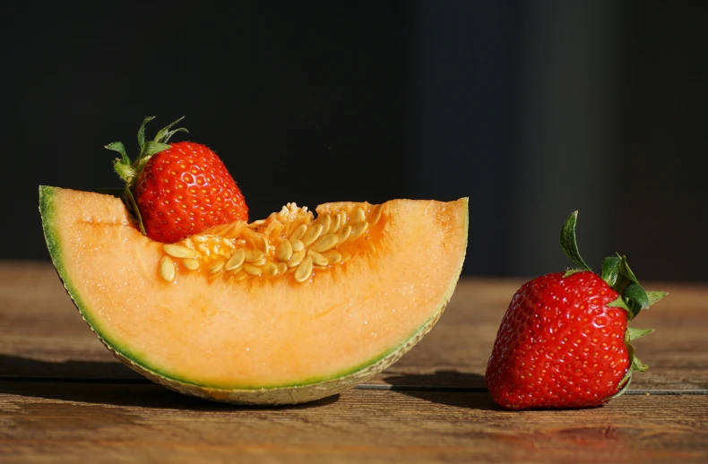 a half of a melon and a strawberry on a table, pexels contest winner, uncrop, curvacious, soft shade, organic and robotic