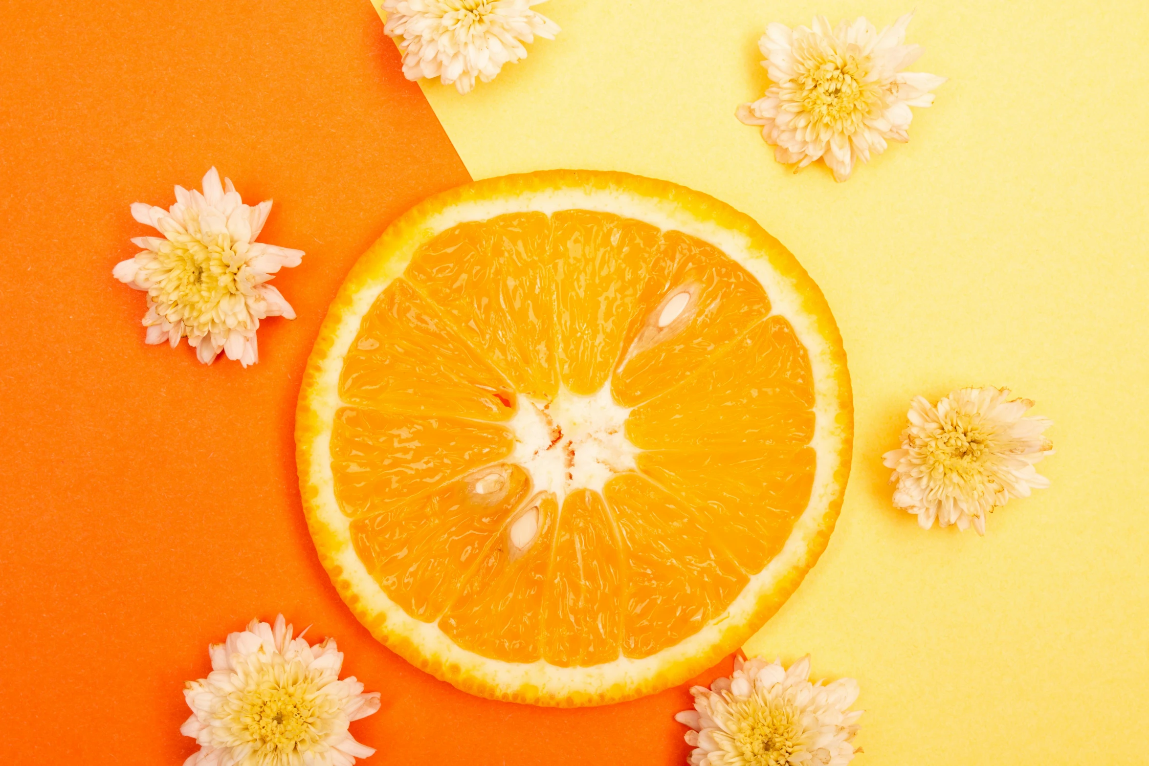 an orange cut in half surrounded by flowers, trending on pexels, 🐿🍸🍋, yellow-orange, soft shade, 🦩🪐🐞👩🏻🦳