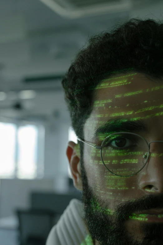 a close up of a man with glasses and a beard, a hologram, hacking into the mainframe, still from a terence malik film, saadane afif, high quality picture