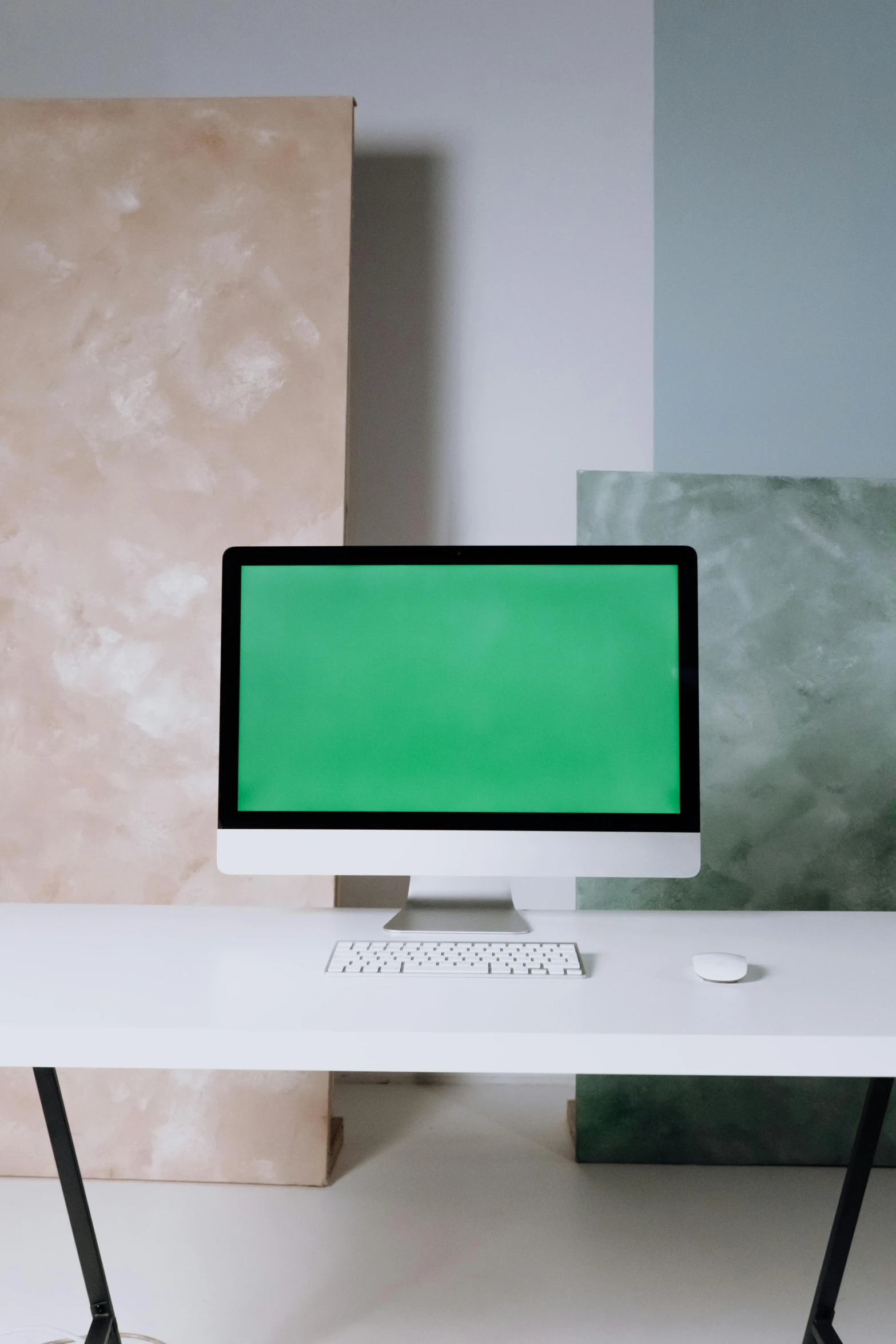 a desktop computer sitting on top of a white desk, inspired by Elsa Bleda, trending on pexels, computer art, green clothes, giant screens, on a pale background, a middle-shot from front