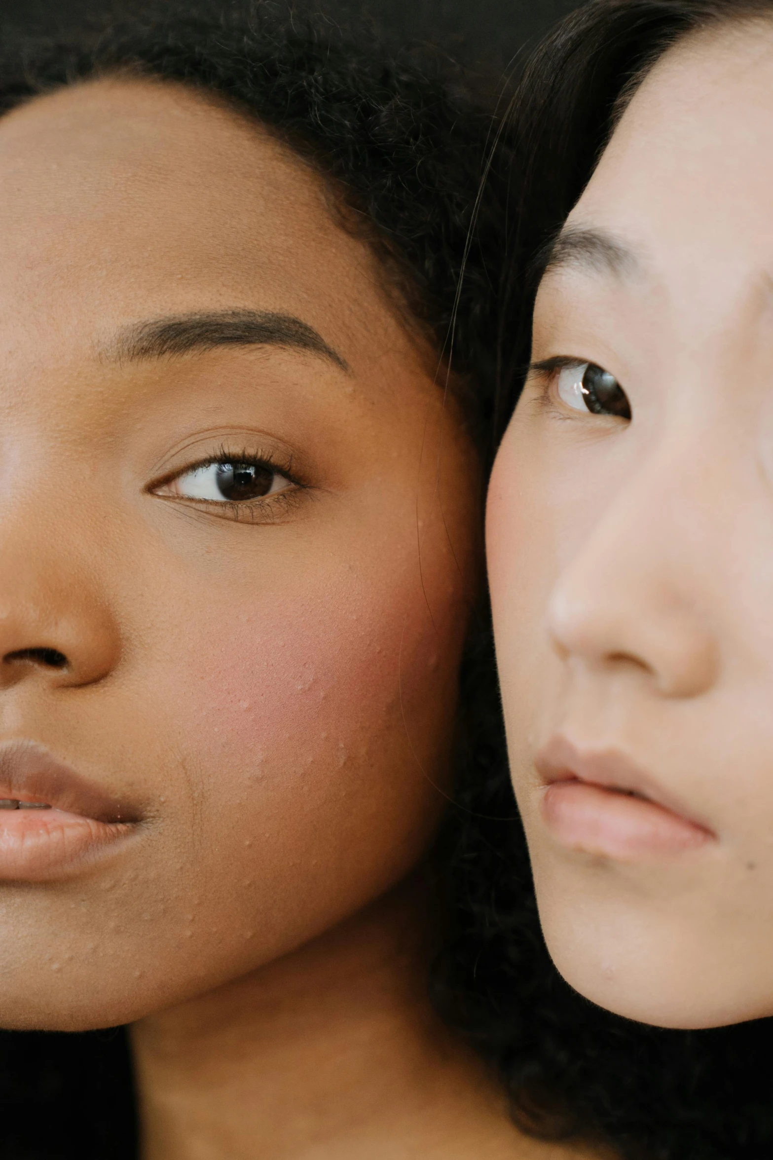 a couple of women standing next to each other, trending on pexels, realism, japanese facial features, brown skin. light makeup, porcelain skin ”, half and half