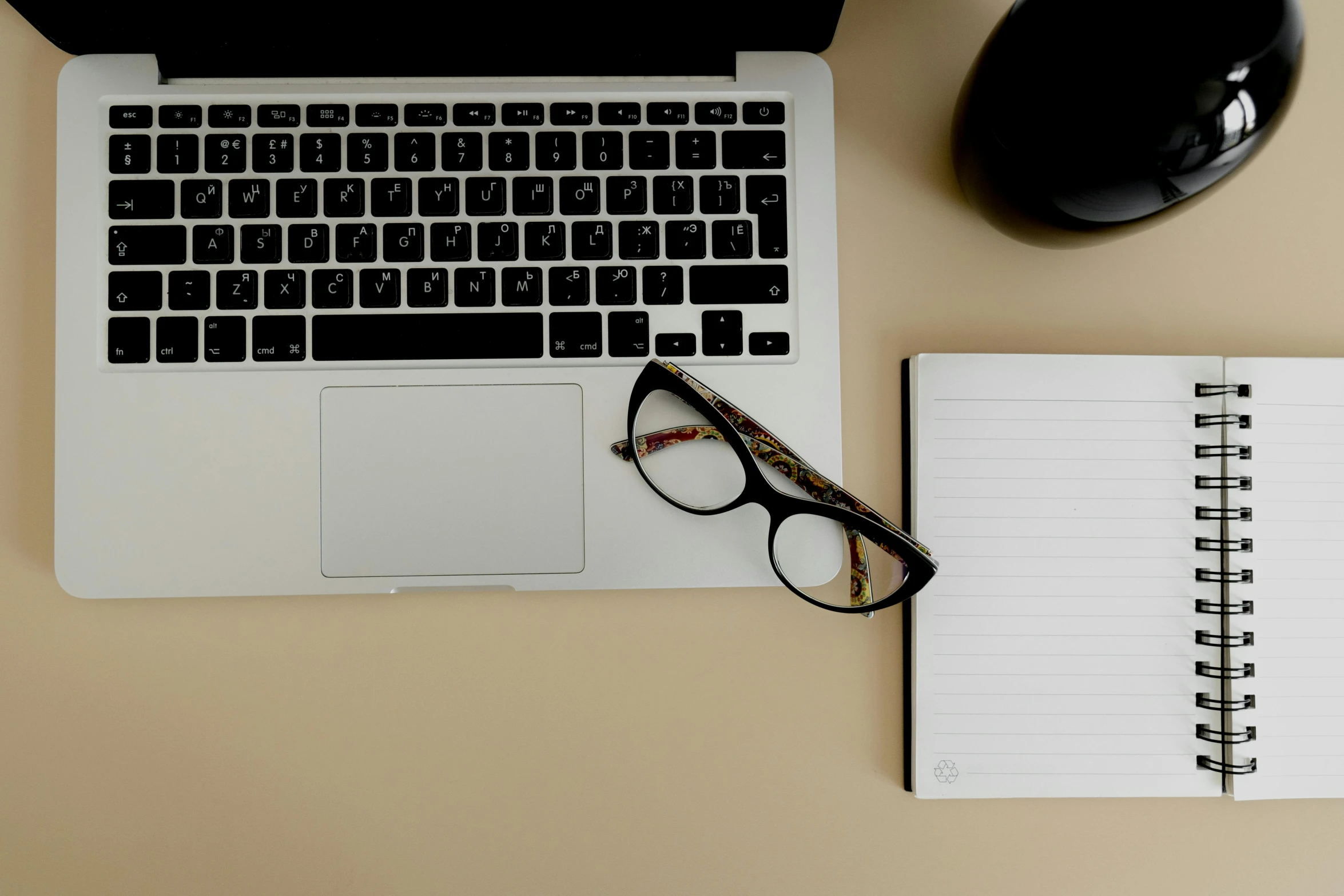 an open laptop computer sitting on top of a desk, by Carey Morris, trending on pexels, figuration libre, black rimmed glasses, lined paper, thumbnail, half-frame square glasses