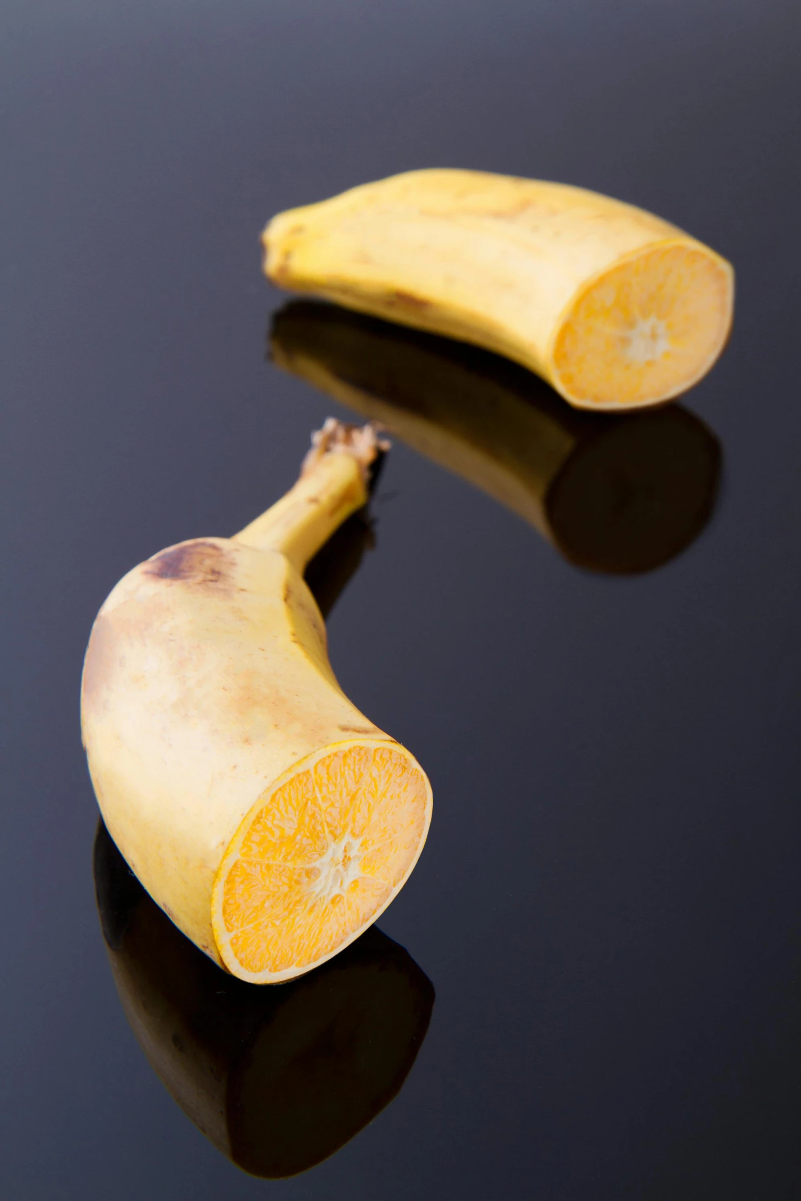 a peeled banana sitting on top of a black surface, a digital rendering, by Matthias Stom, unsplash, peeled oranges, cane, hips, two - tone