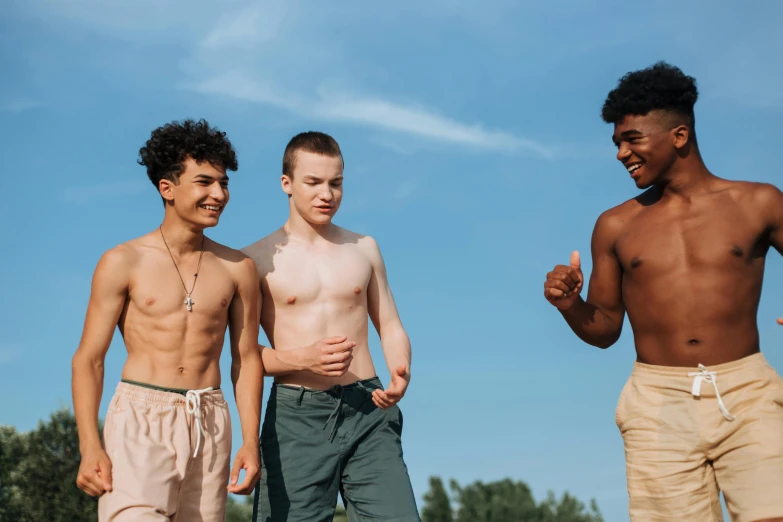 a group of young men standing next to each other, trending on pexels, renaissance, belly button showing, black teenage boy, summer afternoon, pale-skinned